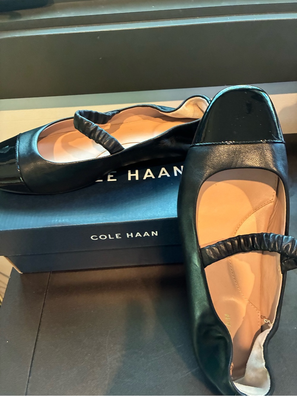 Cole Haan Black Leather Ballet Flats with Elastic Strap. Patent toe.